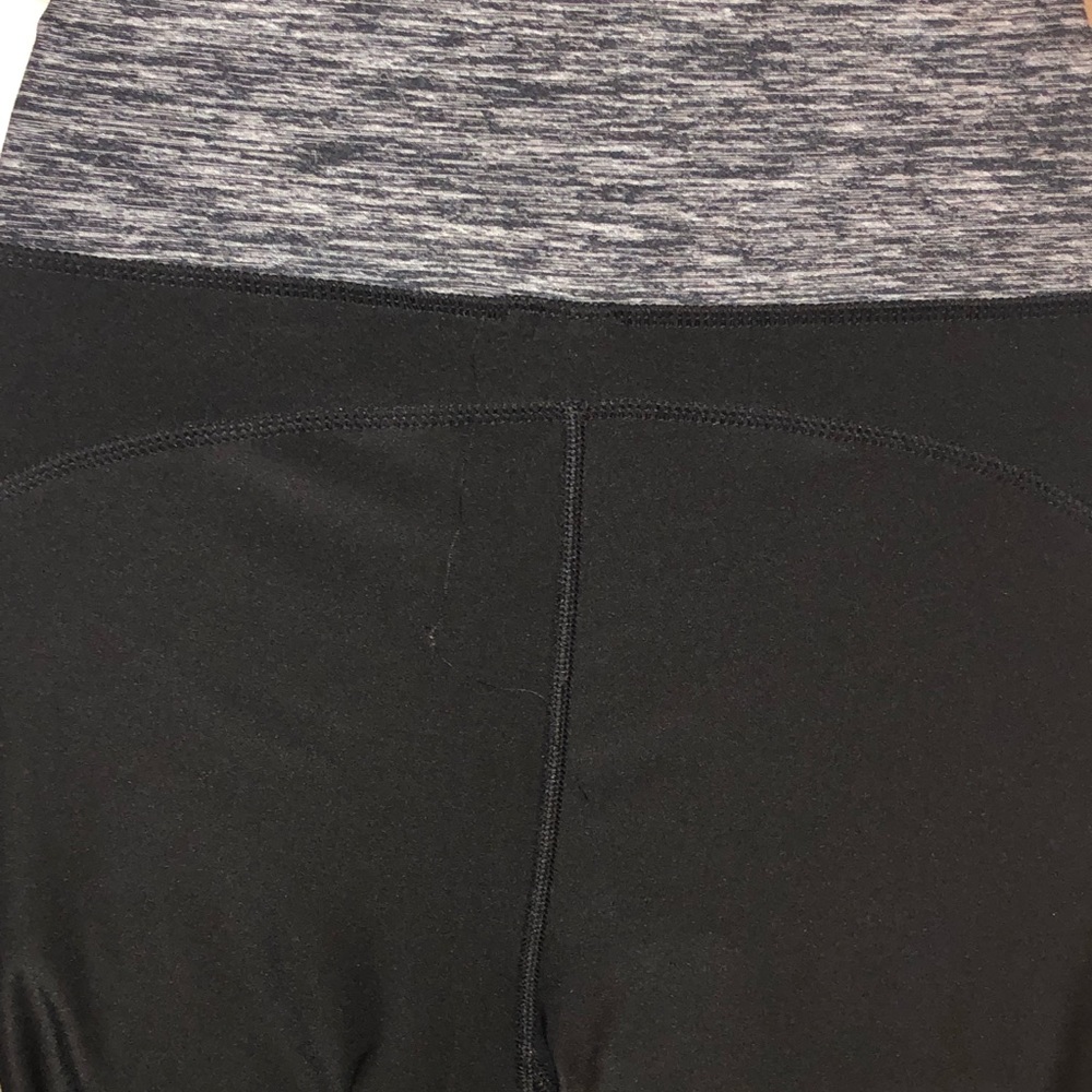 Work out pants with a  silver design.